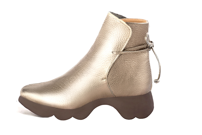 French elegance and refinement for these gold dress booties with laces at the back, 
                available in many subtle leather and colour combinations. The back lacing on this charming bootie ensures a perfect fit around the ankle.
Its wedge sole will isolate you from the ground.
  
                Matching clutches for parties, ceremonies and weddings.   
                You can customize these lace-up ankle boots to perfectly match your tastes or needs, and have a unique model.  
                Choice of leathers, colours, knots and heels. 
                Wide range of materials and shades carefully chosen.  
                Rich collection of flat, low, mid and high heels.  
                Small and large shoe sizes - Florence KOOIJMAN